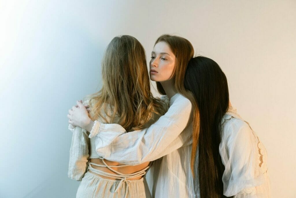 2 Women in White Long Sleeve Shirt